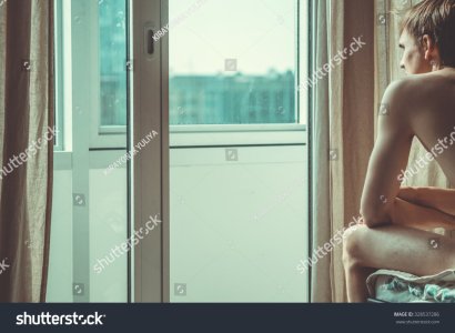 stock-photo-naked-man-looking-out-the-window-328537286.jpg